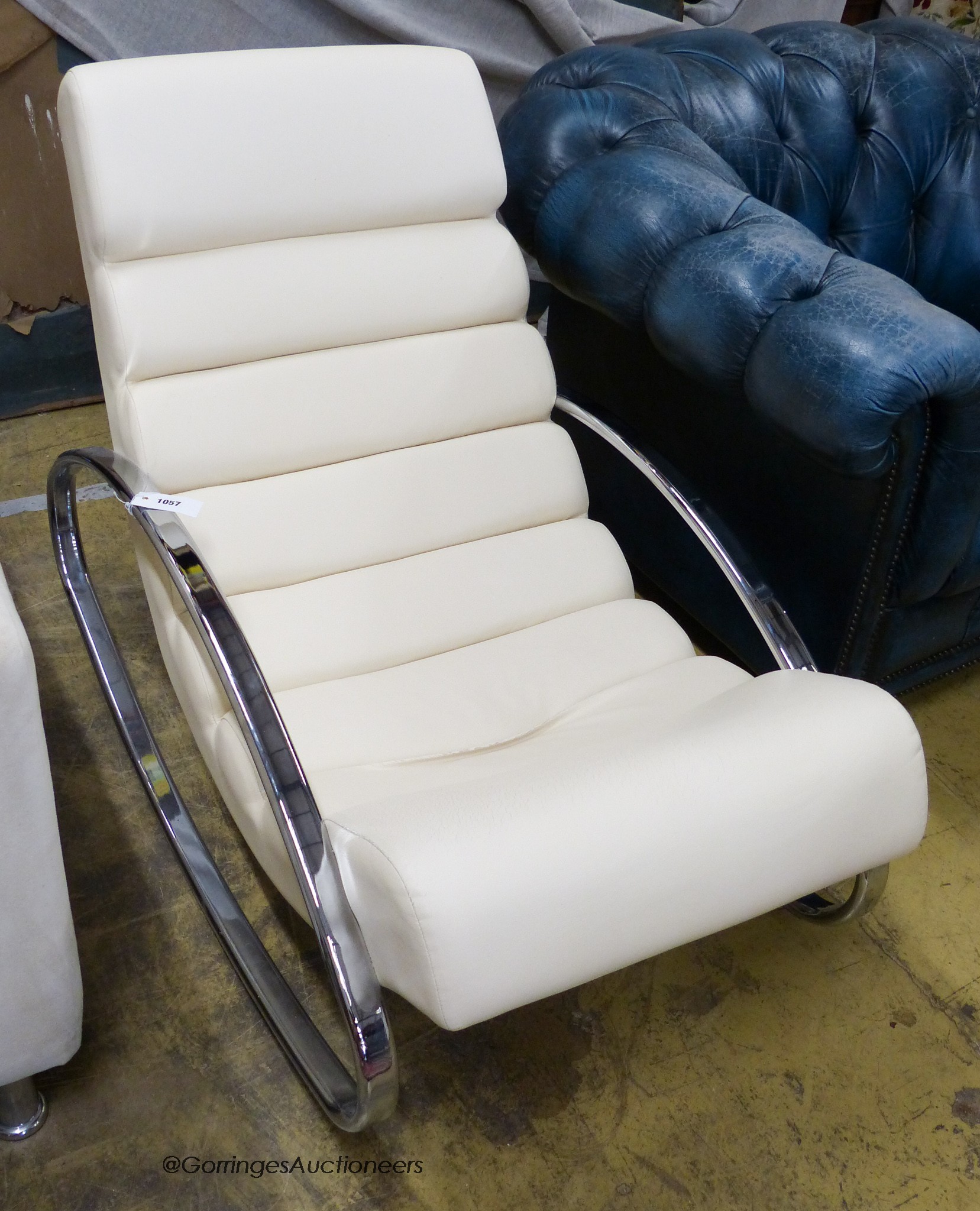 A contemporary Italian style leather and chrome rocking chair. W-61, H-82cm.